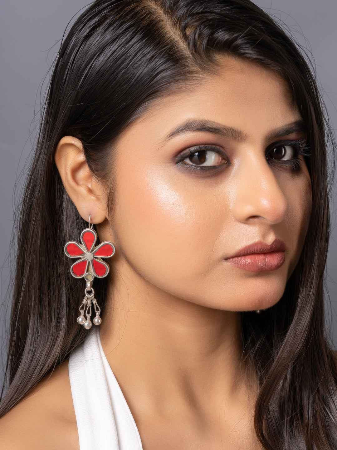 Red and silver Afghani earrings in floral design with dangling beads for a chic look