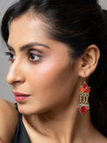 Woman wearing traditional Afghani earrings with red stones and intricate metalwork from LOOK AND ADORN