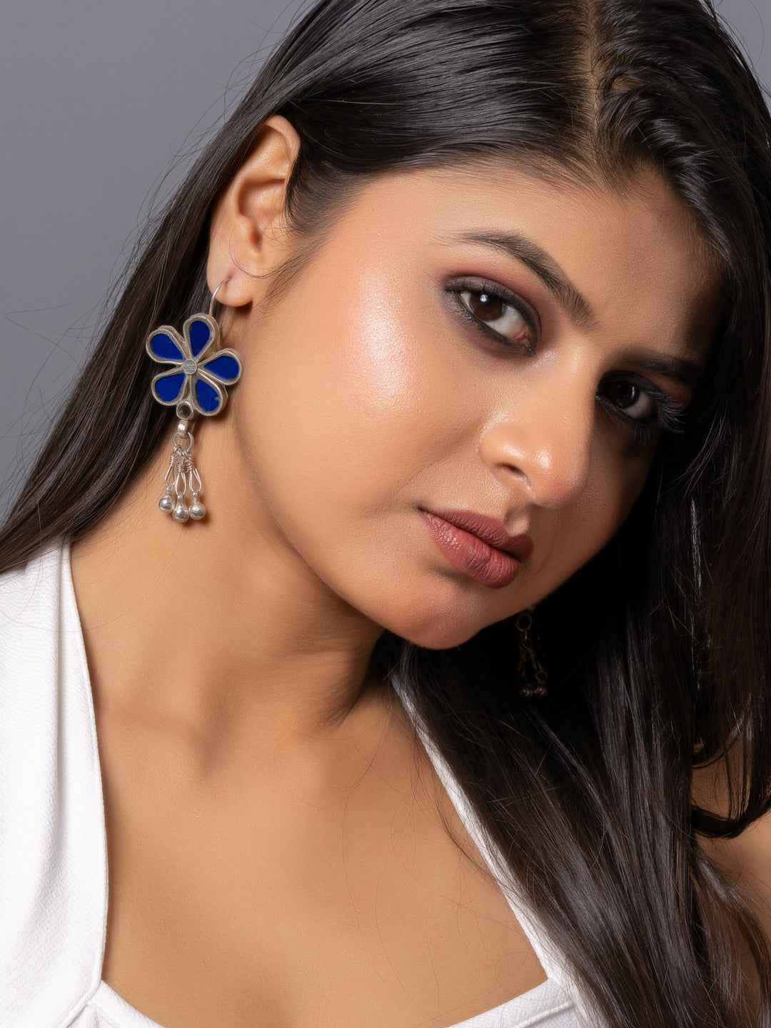 Blue enamel Afghani earrings with intricate floral design and dangling beads for a stylish look