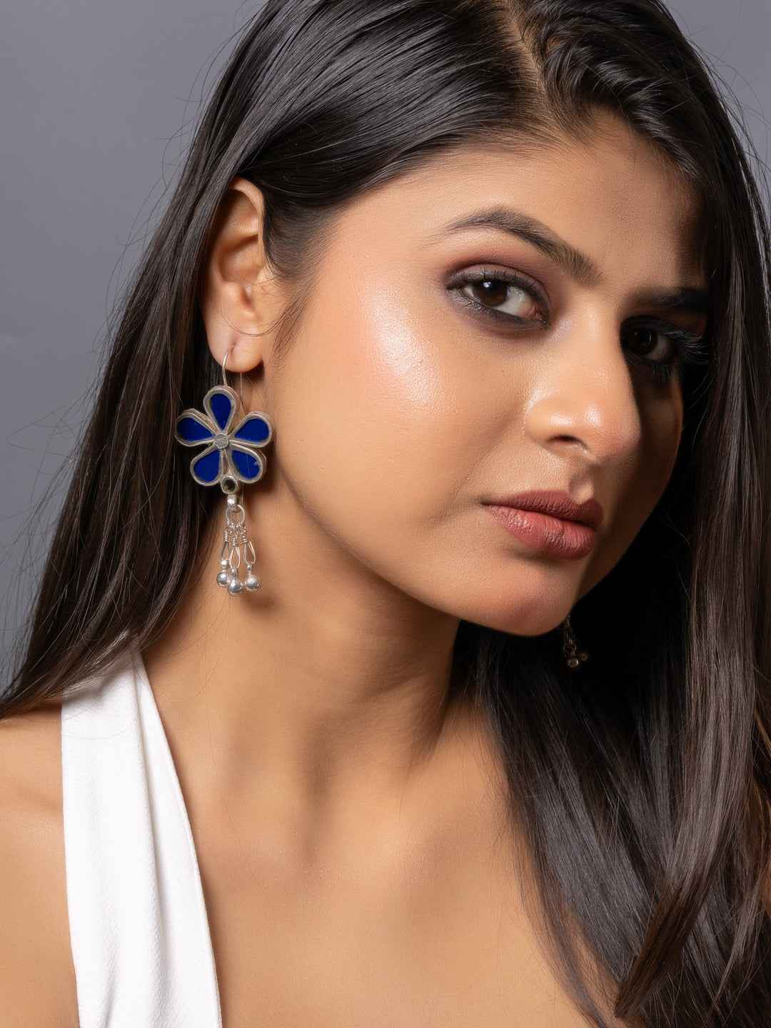 Afghani earrings featuring blue enamel flower design with dangling silver beads for a stylish flair