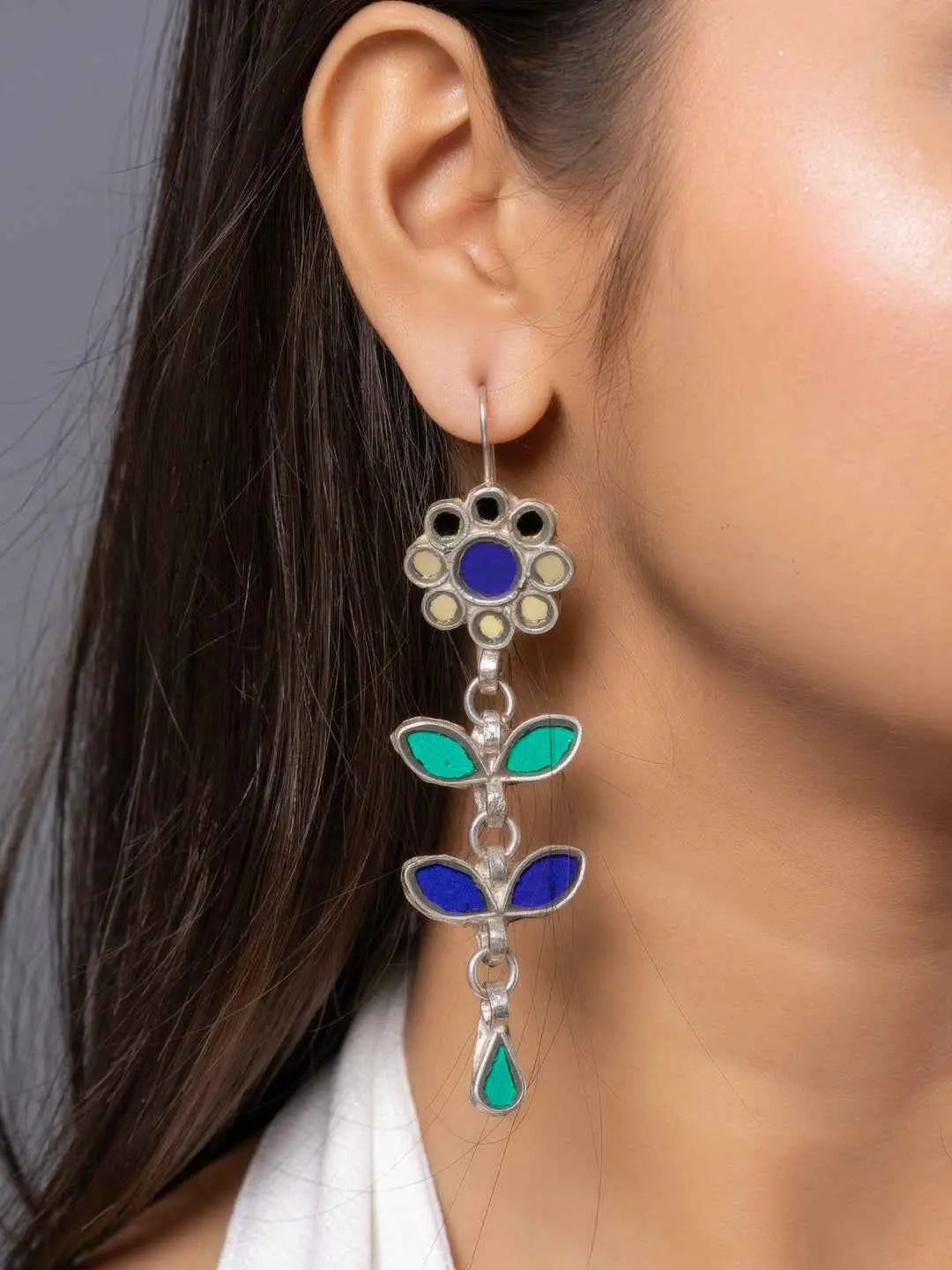 Oxidized Afghani earrings featuring a floral design with blue and green enamel accents