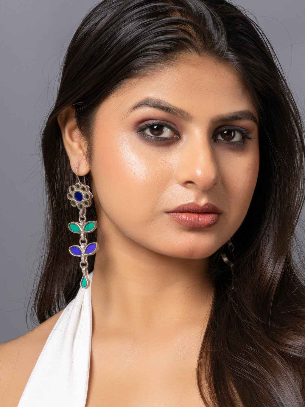 Oxidized silver afghani earrings with blue and green enamel floral design and dangling elements