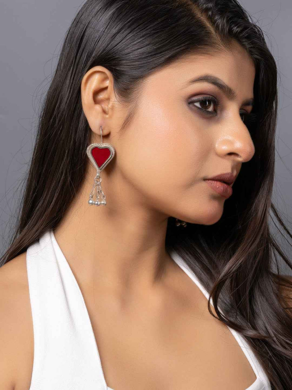 Oxidized silver afghani earrings with red heart design and dangling accents for a stylish look