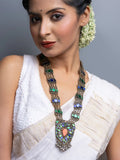 Woman wearing traditional Afghani necklace with colorful stones and intricate metalwork