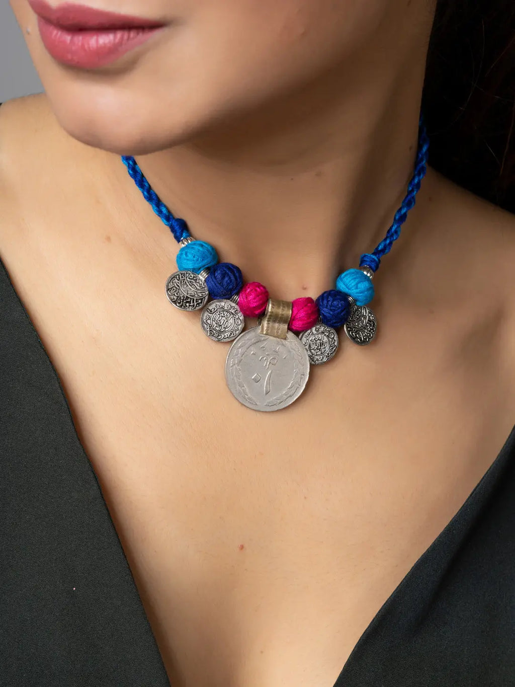 Afghani pendant necklace with colorful beads and silver coin charms from LOOK AND ADORN