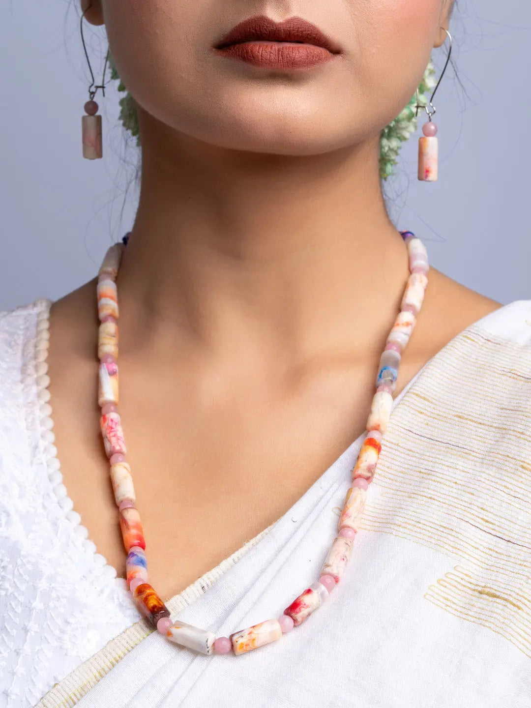 Handmade agate necklace with multicolored polished stones worn with matching earrings by LOOK AND ADORN