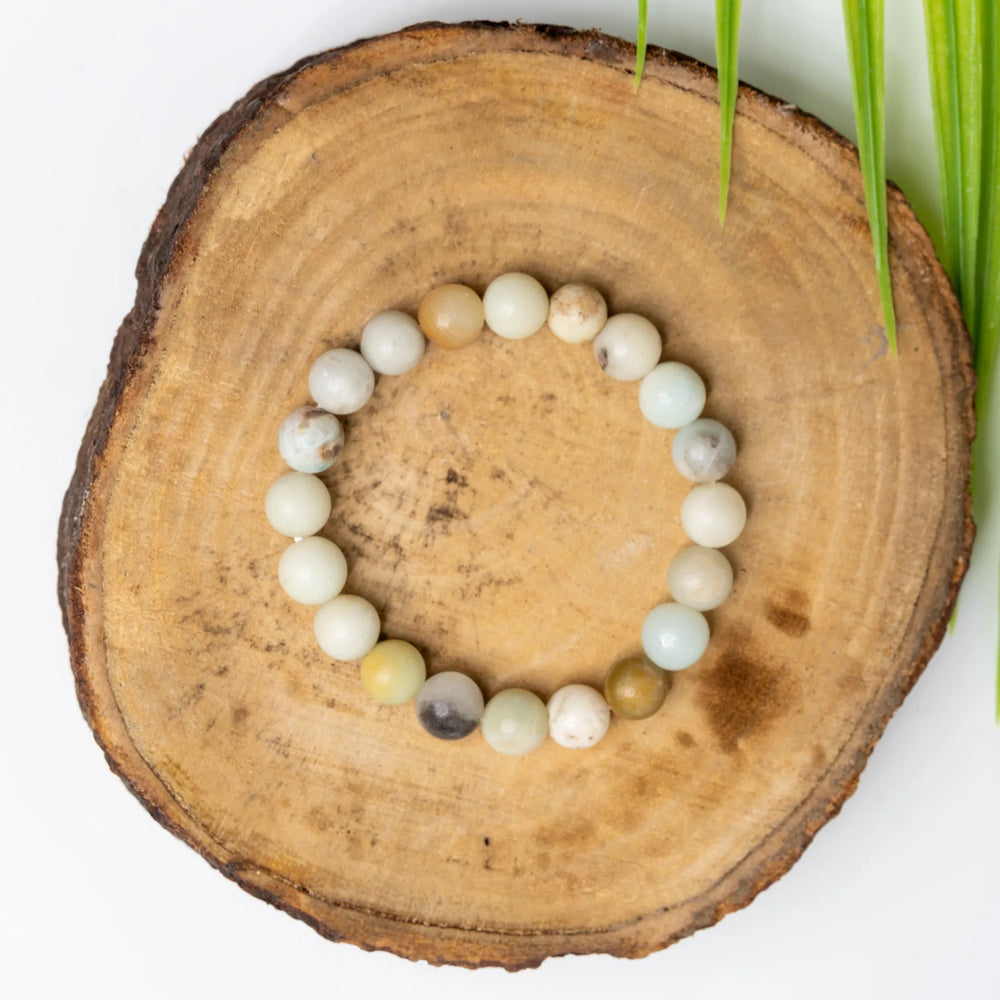Beautiful amazonite bracelet made of natural gemstones on a wooden display for a stylish look