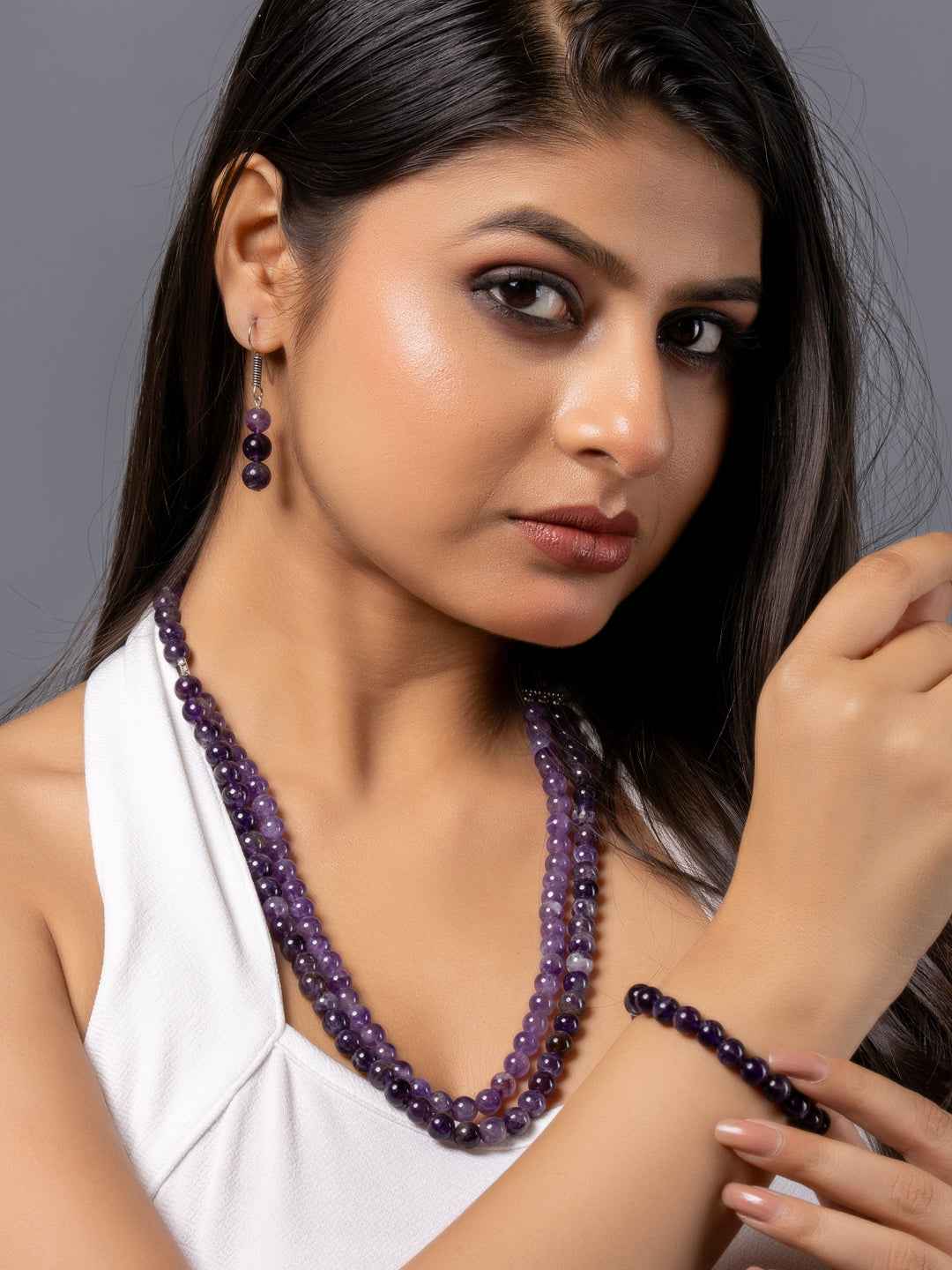 Handmade amethyst necklace set featuring rich purple beads, matching bracelet, and elegant earrings
