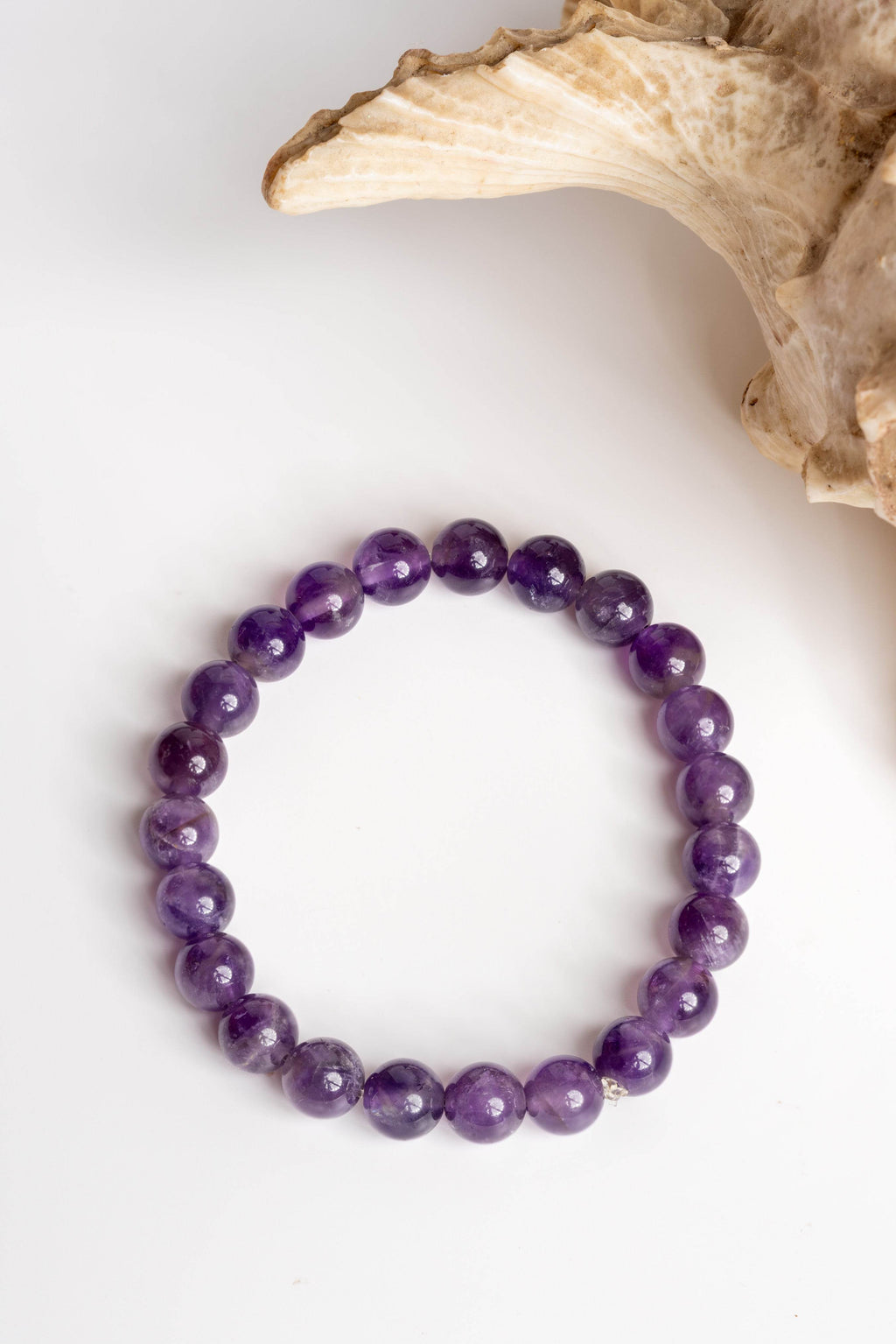 Amethyst stone bracelet by LOOK AND ADORN featuring smooth, polished purple gemstones