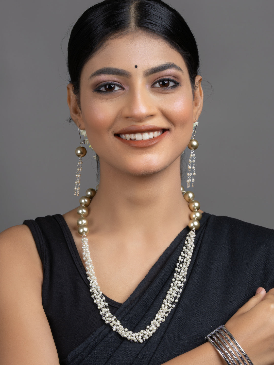 LOOK AND ADORN handmade pearl necklace set worn by smiling model with layered pearls and matching long earrings