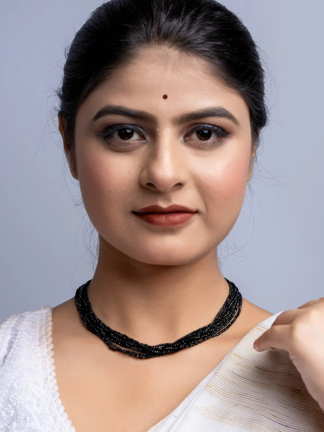 Elegant black crystal necklace handmade jewelry worn by woman with white outfit