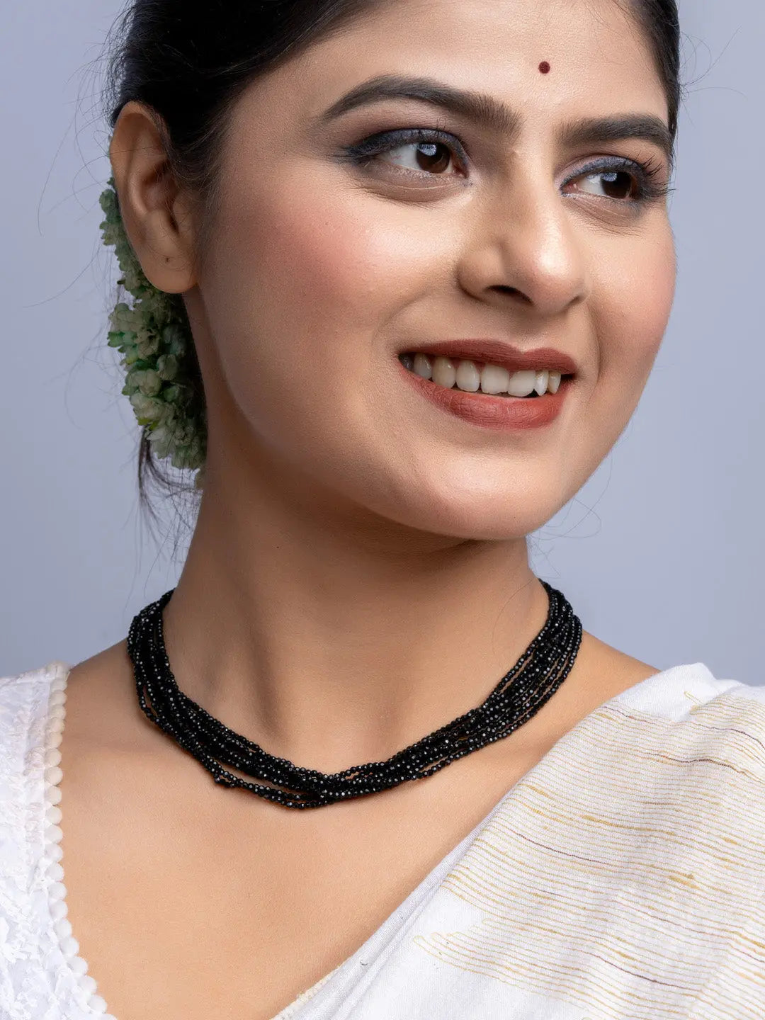 Elegant handmade black crystal necklace from LOOK AND ADORN worn by woman with traditional attire
