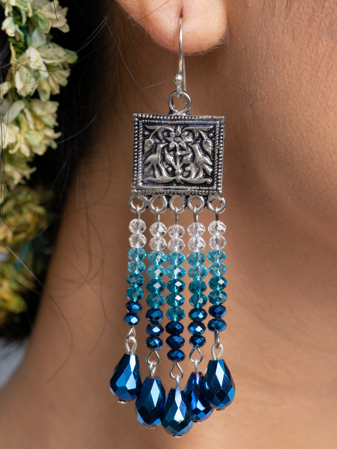 Handmade blue crystal earrings with silver decorative top and dangling blue and clear beads
