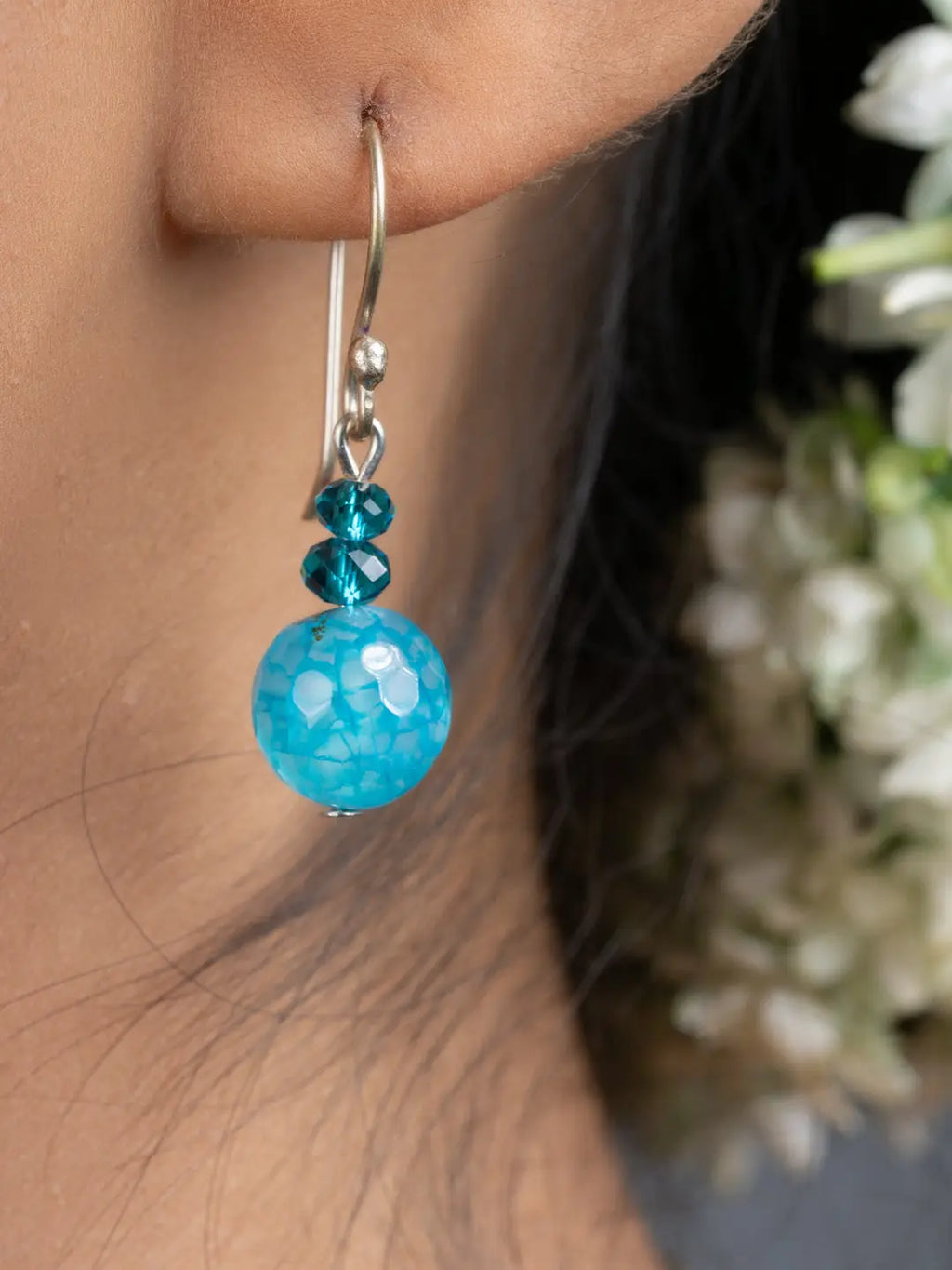 LOOK AND ADORN Blue Onyx Necklace Set shown with matching turquoise dangle earring on ear handmade jewelry