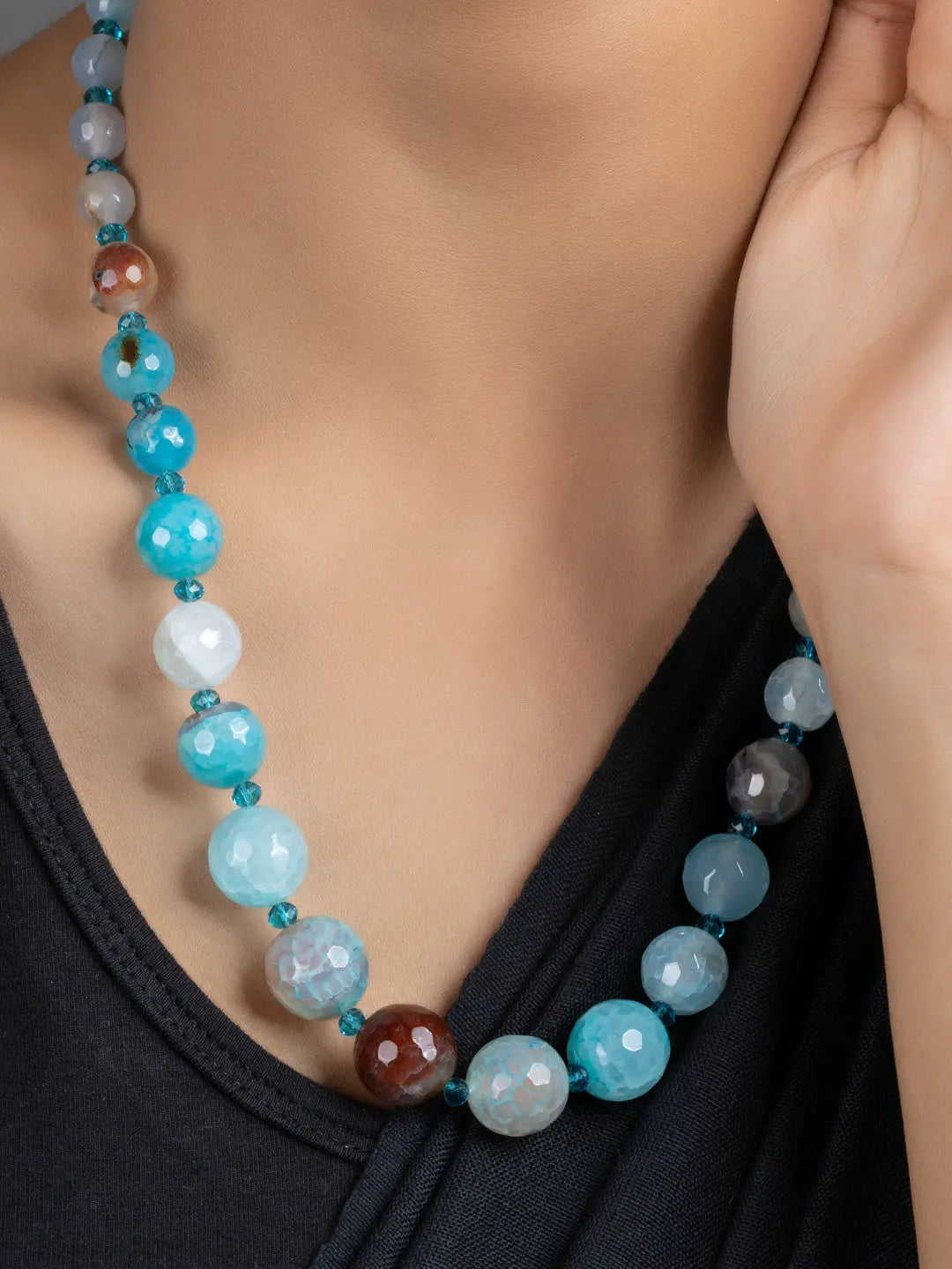 Blue Onyx Necklace Set handmade by LOOK AND ADORN worn on model showing faceted blue and brown round beads
