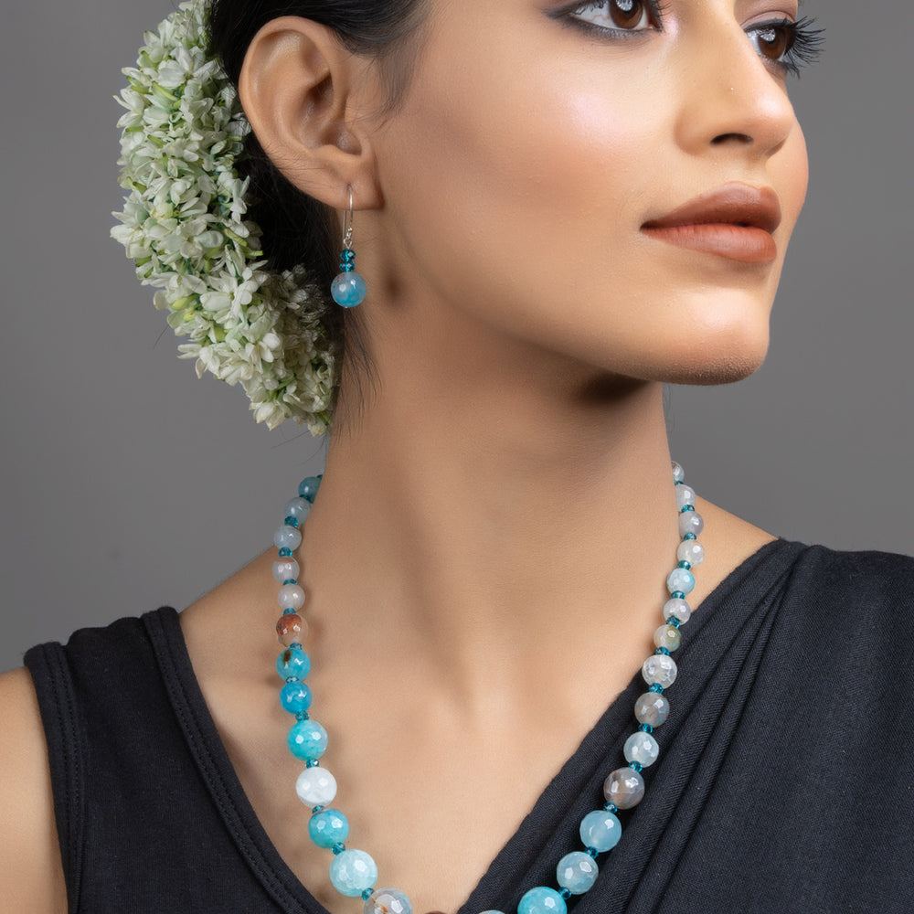 LOOK AND ADORN Blue Onyx Necklace Set on model with matching earrings handmade jewelry elegant statement piece