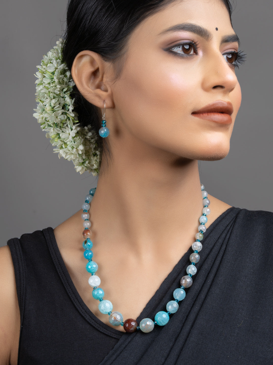LOOK AND ADORN Blue Onyx Necklace Set on model with matching earrings handmade jewelry elegant statement piece