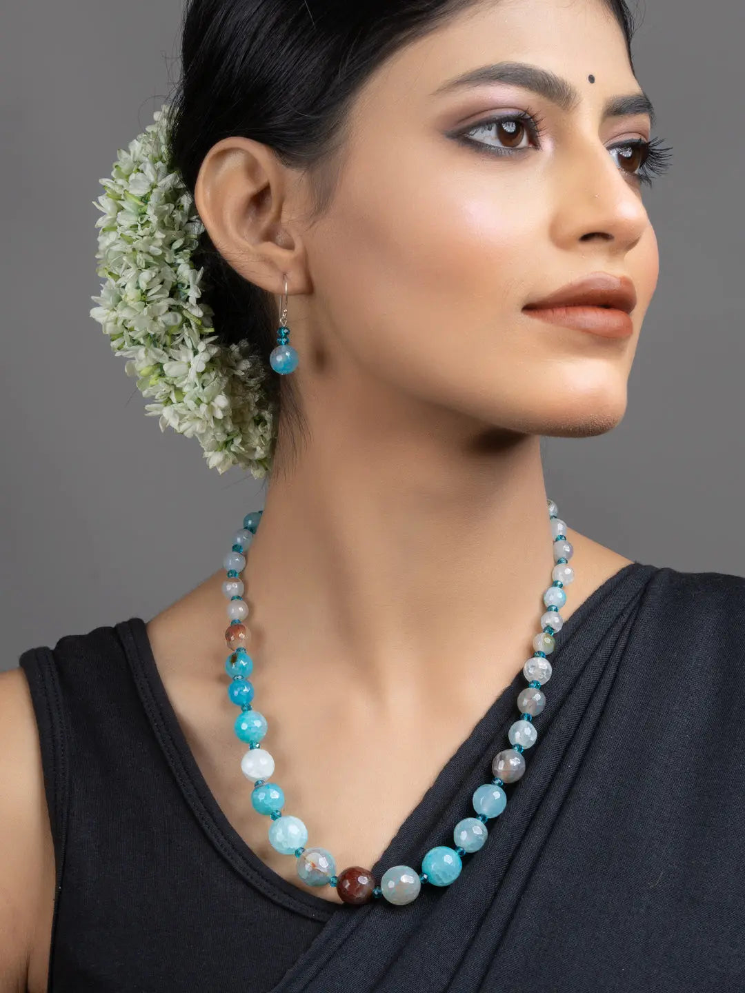 LOOK AND ADORN Blue Onyx Necklace Set on model with matching earrings handmade jewelry elegant statement piece