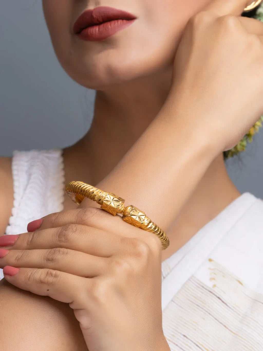 LOOK AND ADORN gold plate bangle on model wrist showing textured double cuff style gold plated jewelry