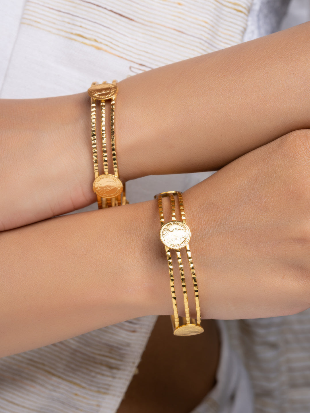 LOOK AND ADORN gold plated bangle set three strand design with coin medallions on paired wrists