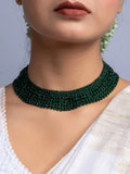 Handmade green crystal necklace by LOOK AND ADORN worn on neck with white traditional attire