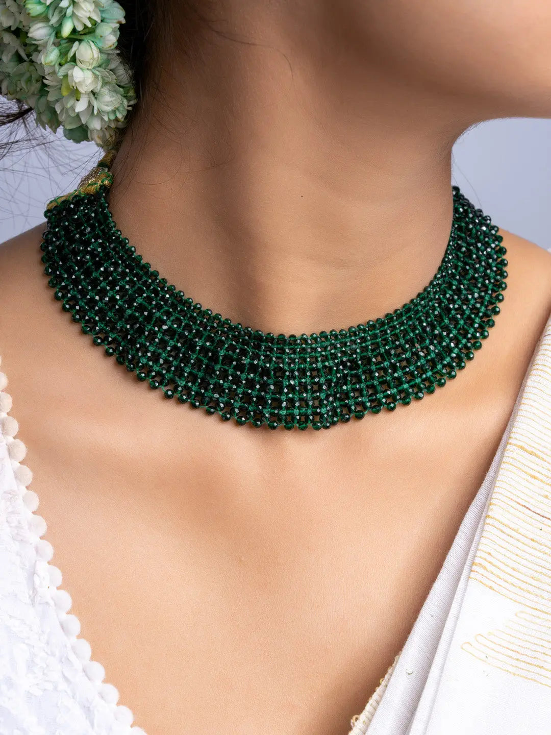 Handmade green crystal necklace by LOOK AND ADORN featuring intricate beaded design on a model's neck