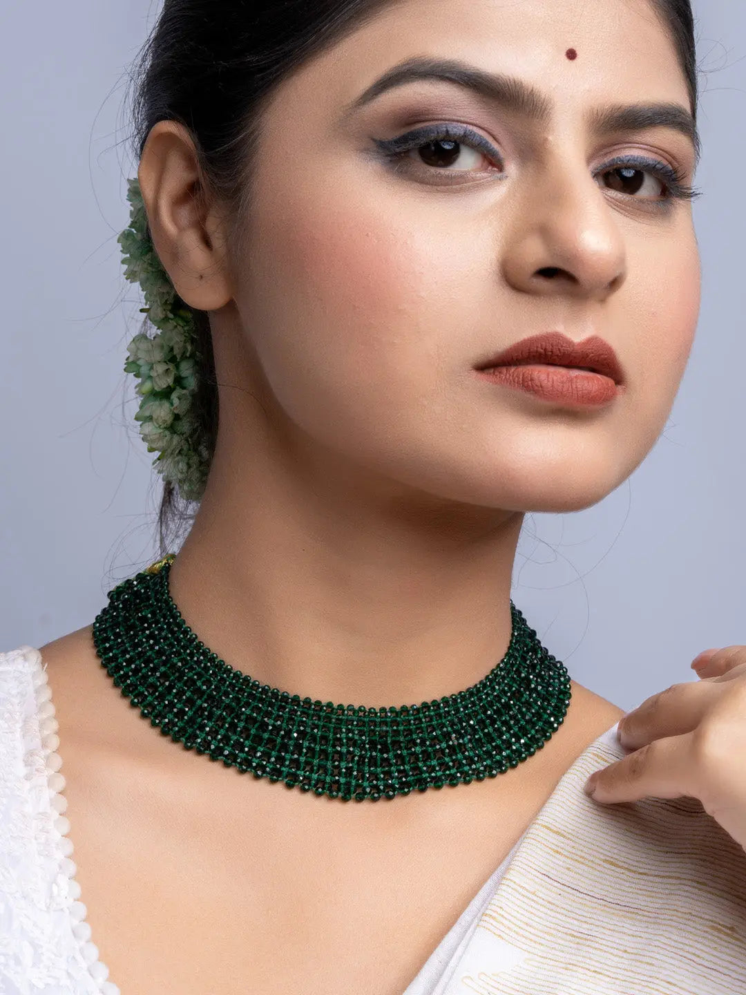 Handmade green crystal necklace by LOOK AND ADORN worn by woman with traditional attire