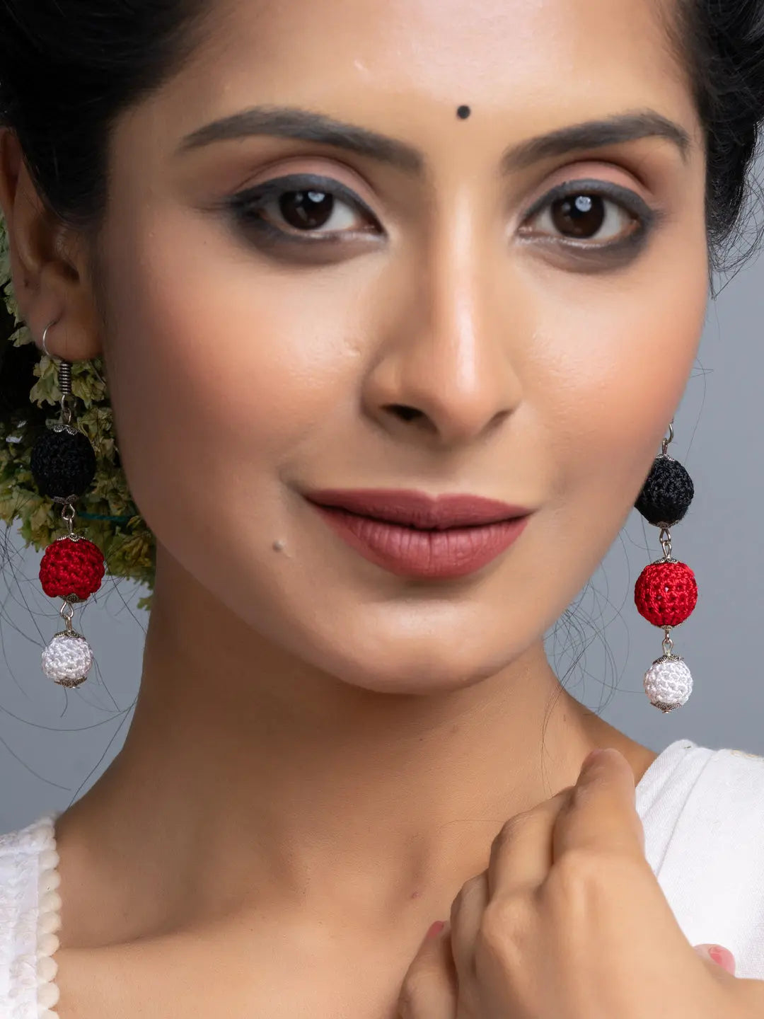 Handmade Black Red Earrings worn by woman with elegant makeup showcasing LOOK AND ADORN jewelry
