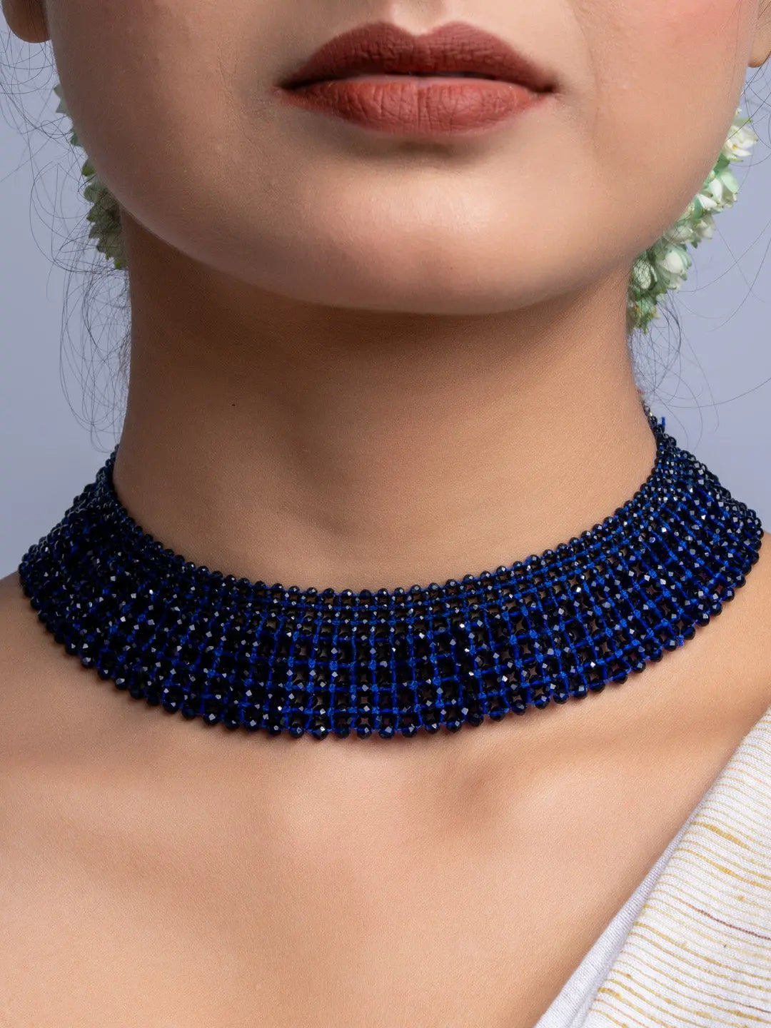 Handmade blue crystal necklace by LOOK AND ADORN closely fitted around the neck with multiple strands