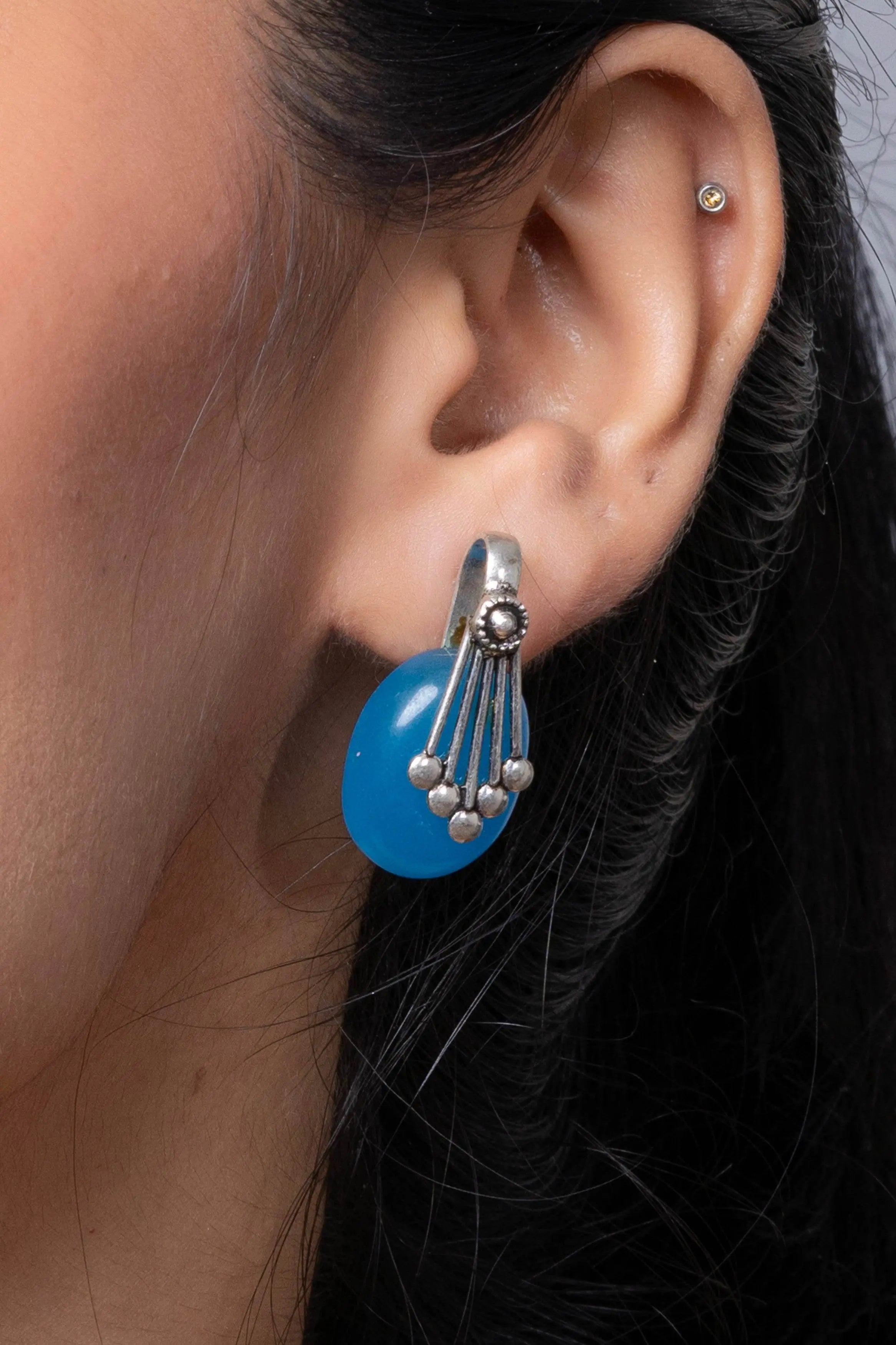 Oxidised Silver Blue Stone Stud Earring from LOOK AND ADORN designed for you, showcased on a model's ear
