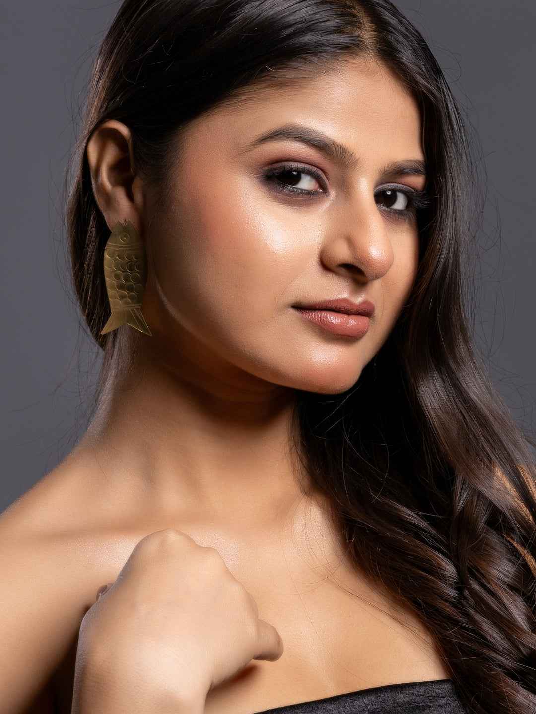 Elegant brass earrings with fish design, perfect for adding a unique touch to your outfit