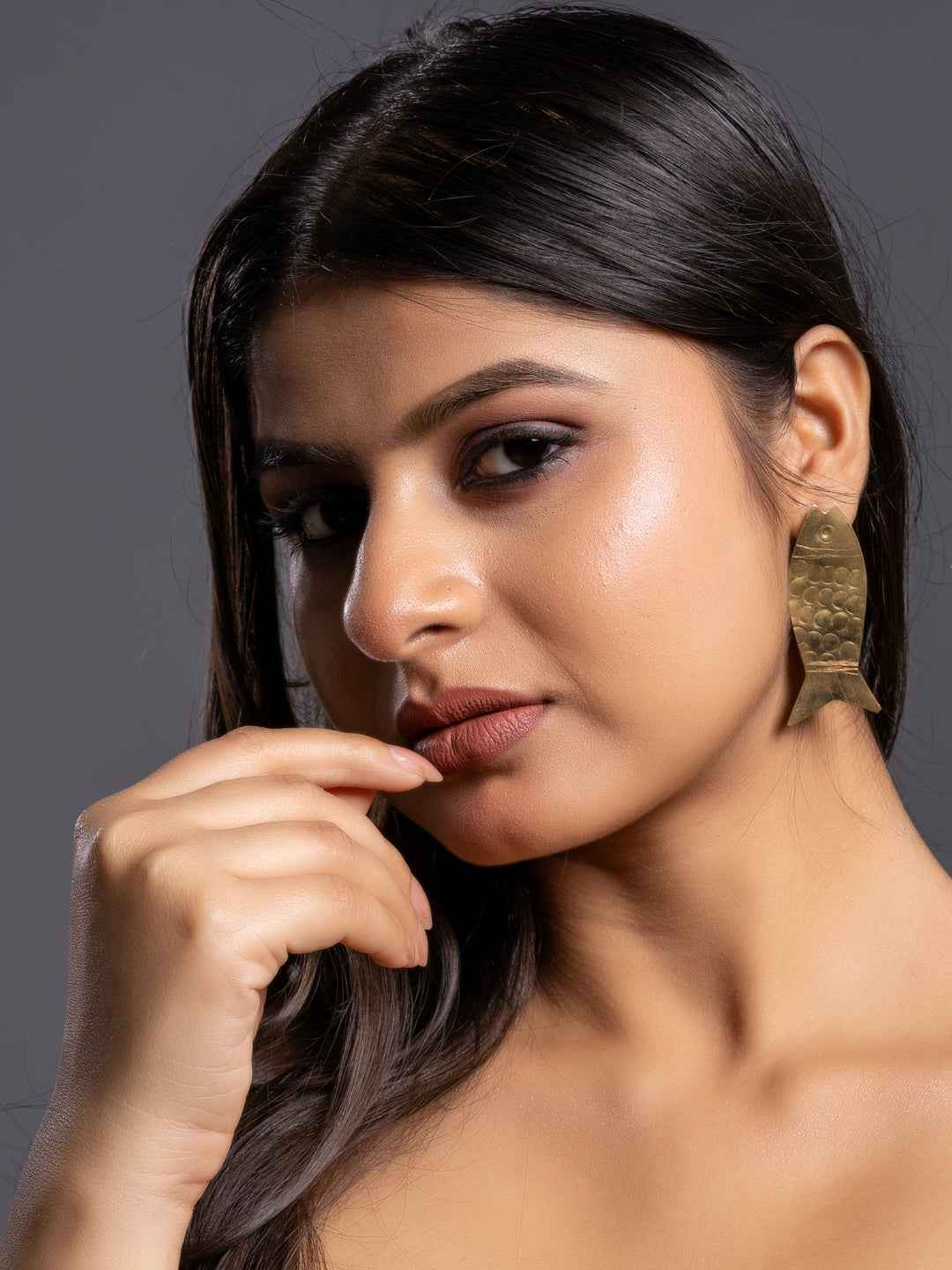 Stylish brass earrings with a unique fish shape design, perfect for adding elegance to any outfit