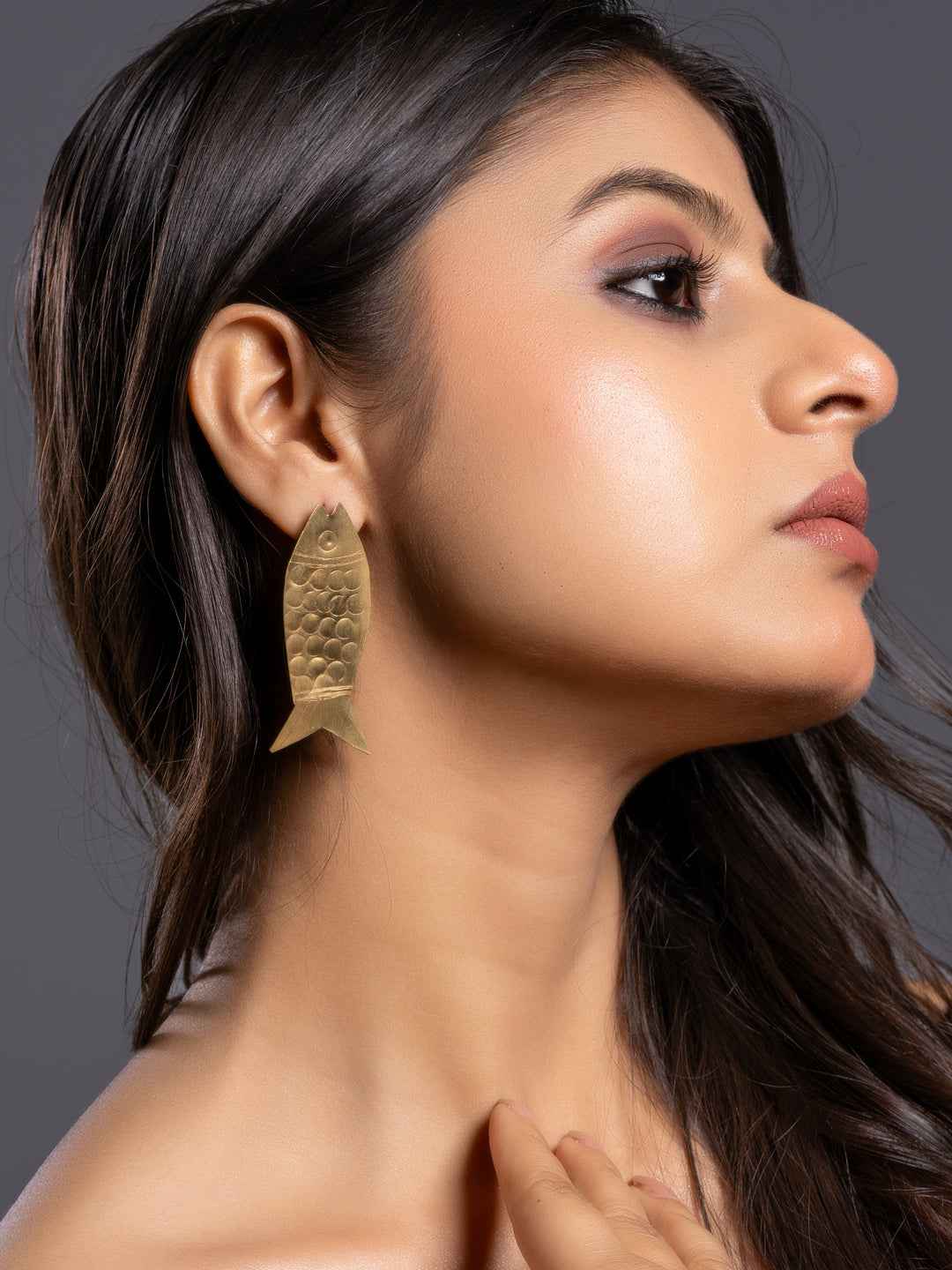 Brass earrings in fish shape with a textured finish, designed for a unique and stylish look