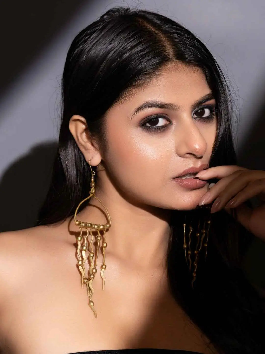 Elegant brass earrings in a unique design featuring dangling accents for a modern look