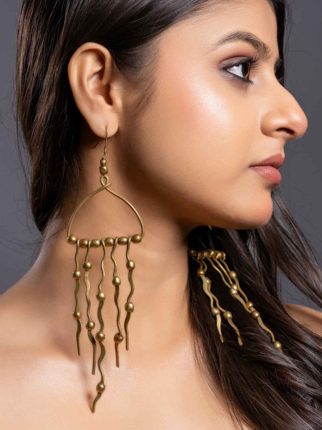 Unique Dokra brass earrings with varied hanging designs, showcasing a vintage look and intricate craftsmanship