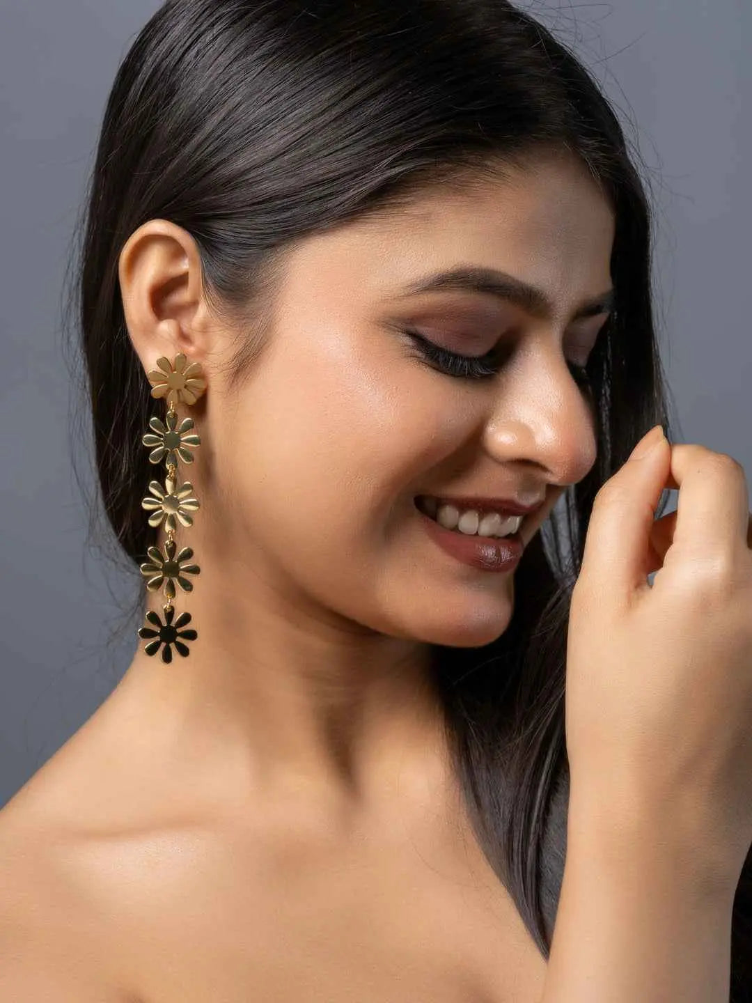 Gold brass stud earrings with floral design, perfect for adding elegance to any outfit