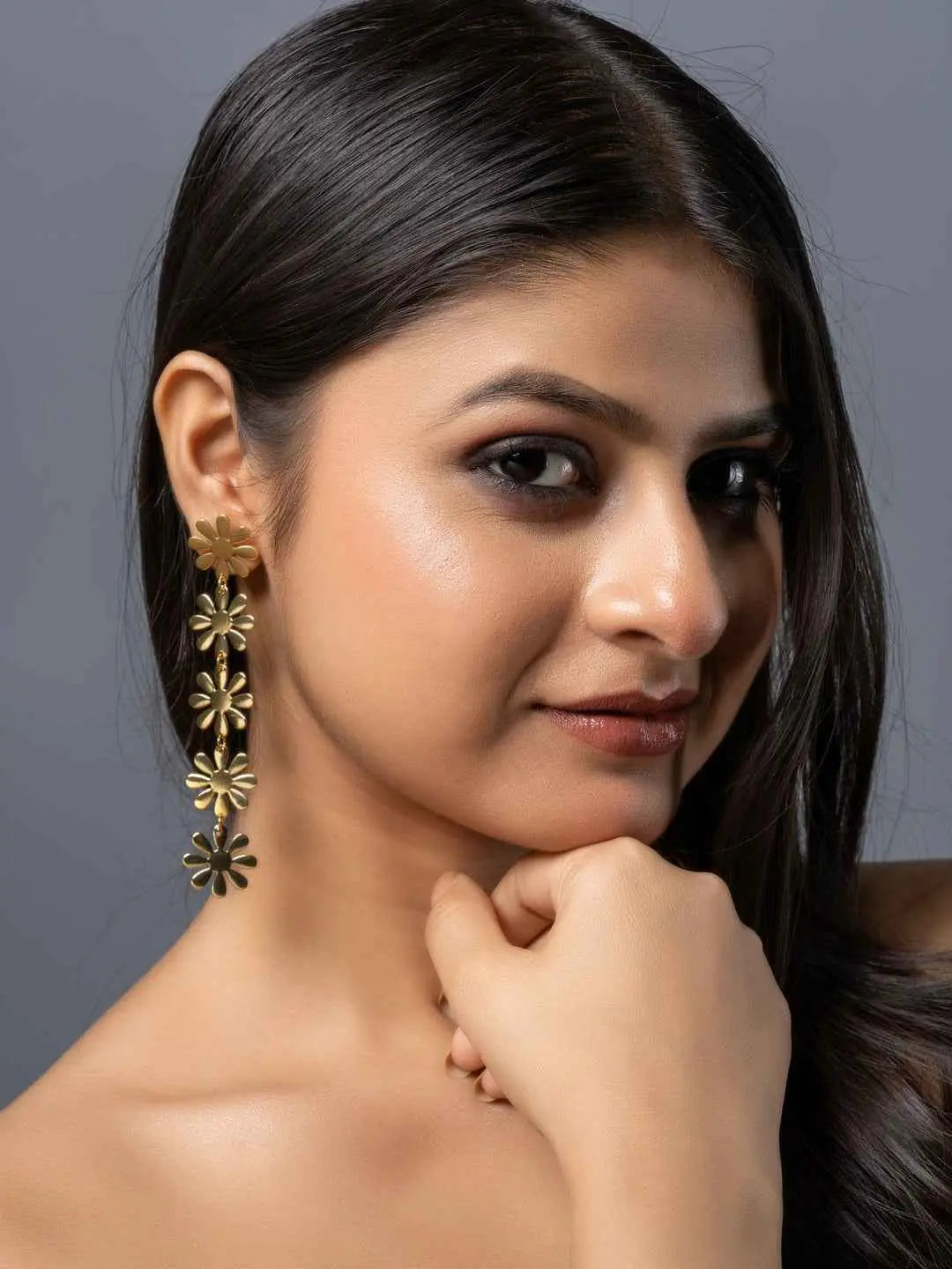 Elegant brass stud earrings featuring intricate flower designs for a stylish touch