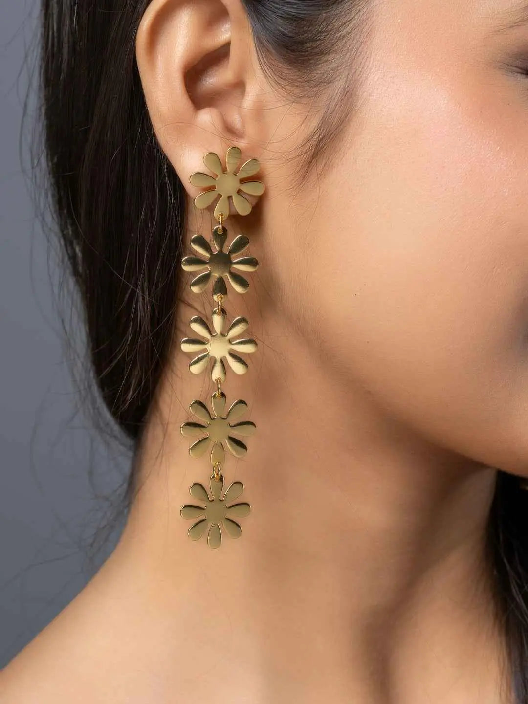 Brass stud earrings with floral design, featuring multiple gold flower motifs for a stylish look