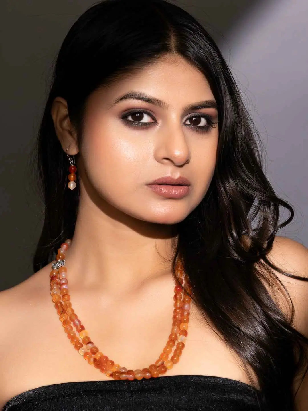 Handmade carnelian necklace set featuring vibrant orange beads with matching earrings for a stylish look