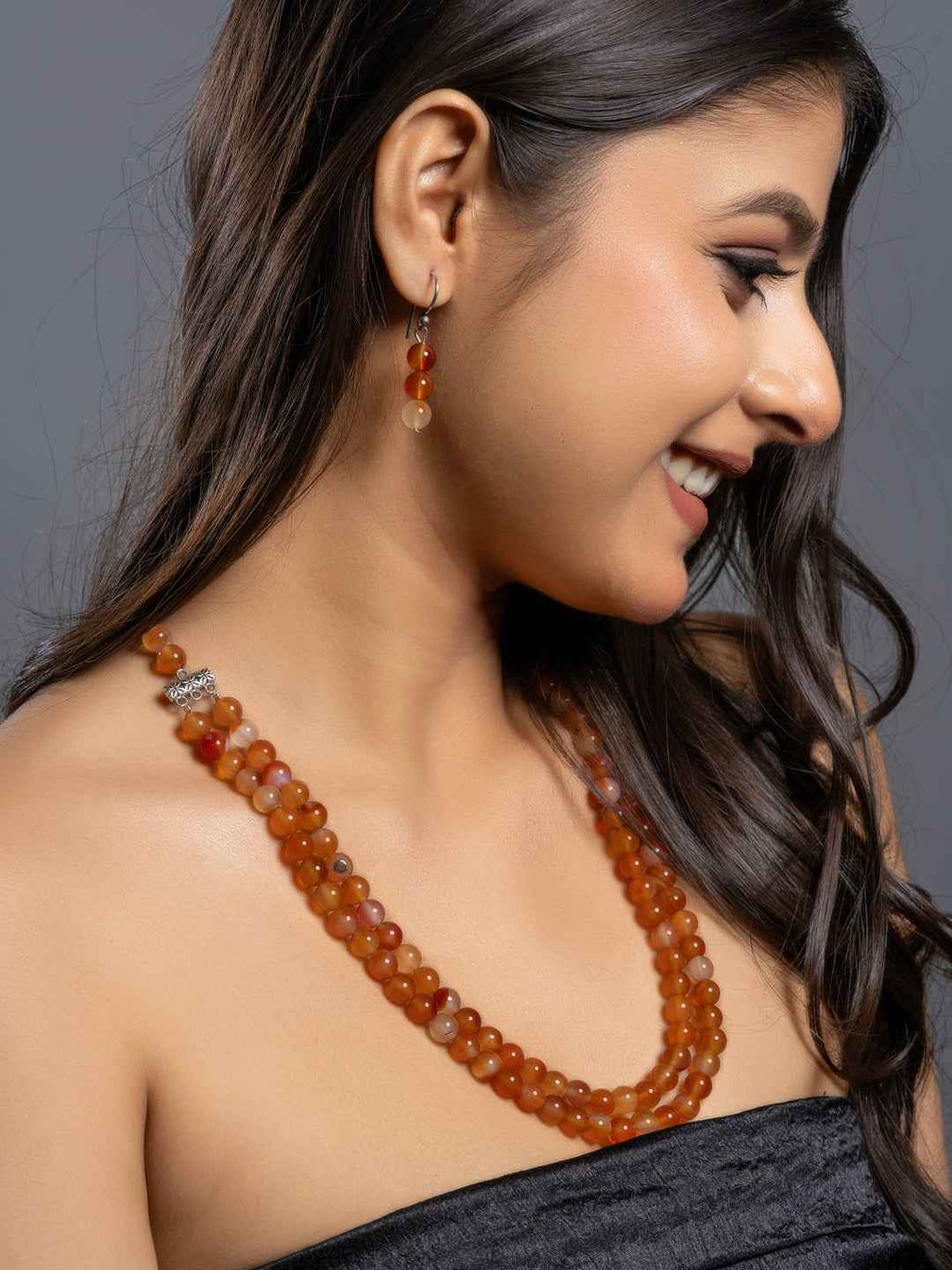 Handmade carnelian necklace set featuring vibrant orange beads with matching earrings for a stylish look