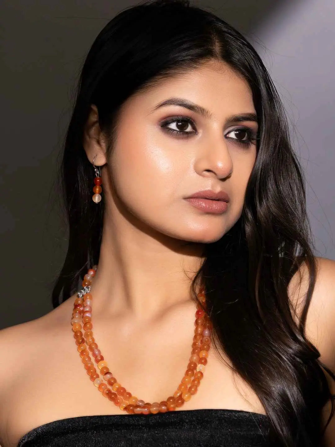 Elegant carnelian necklace set featuring orange beads, perfect for accessorizing any outfit
