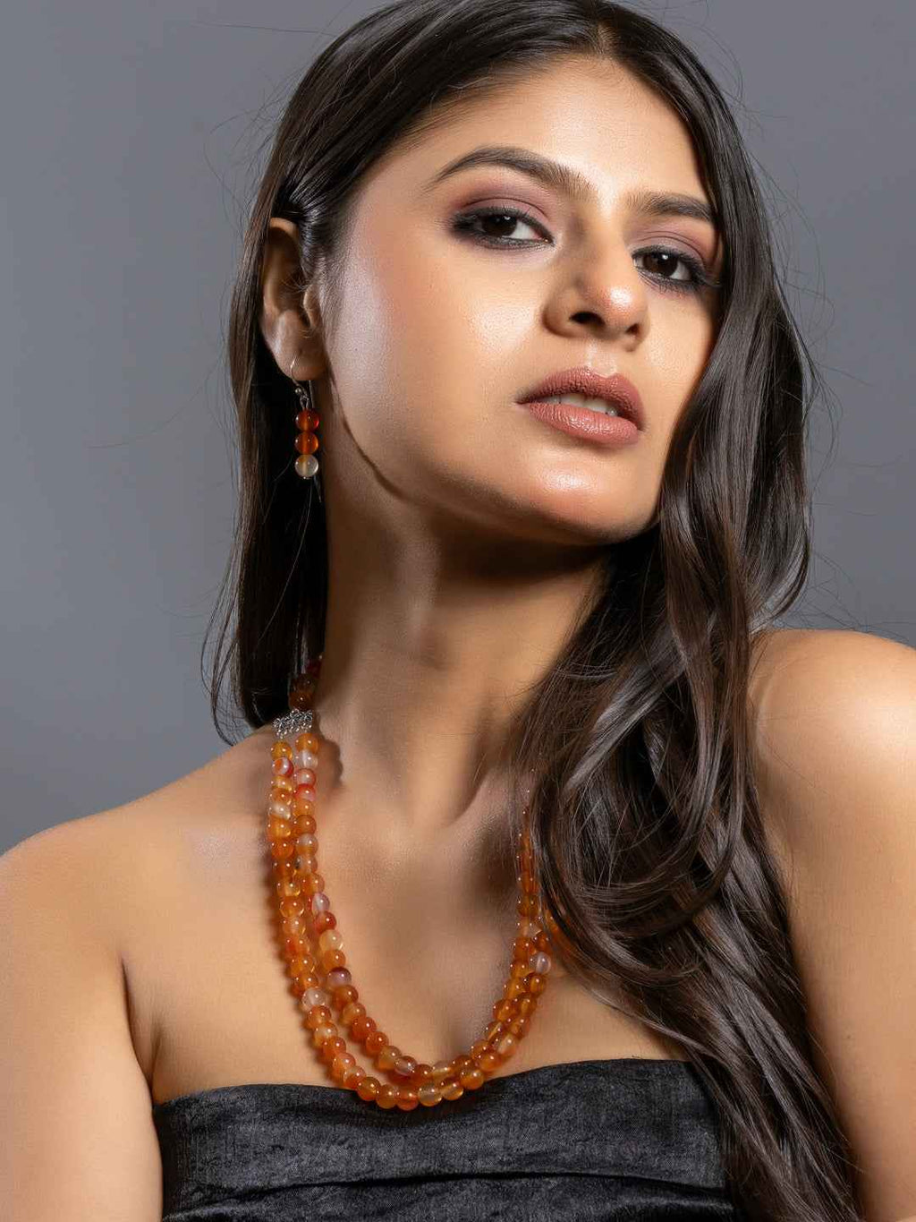 Elegant handmade carnelian necklace set with vibrant orange beads and matching earrings