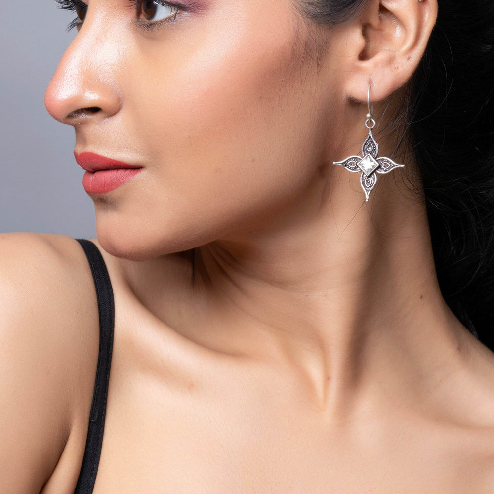 LOOK AND ADORN oxidised silver cubic zirconia earring dangling elegantly on a model