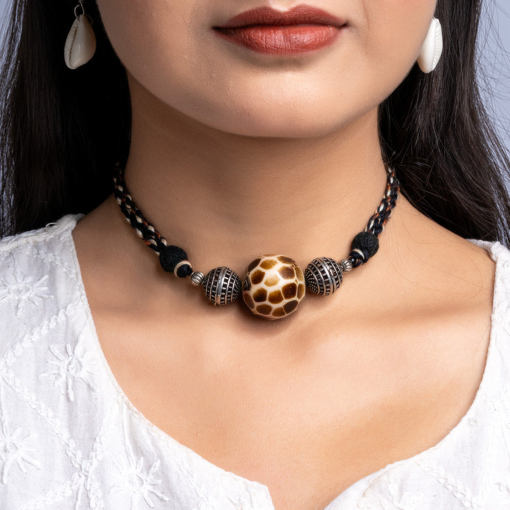 Handmade german silver choker set with intricate beads worn by woman in white top