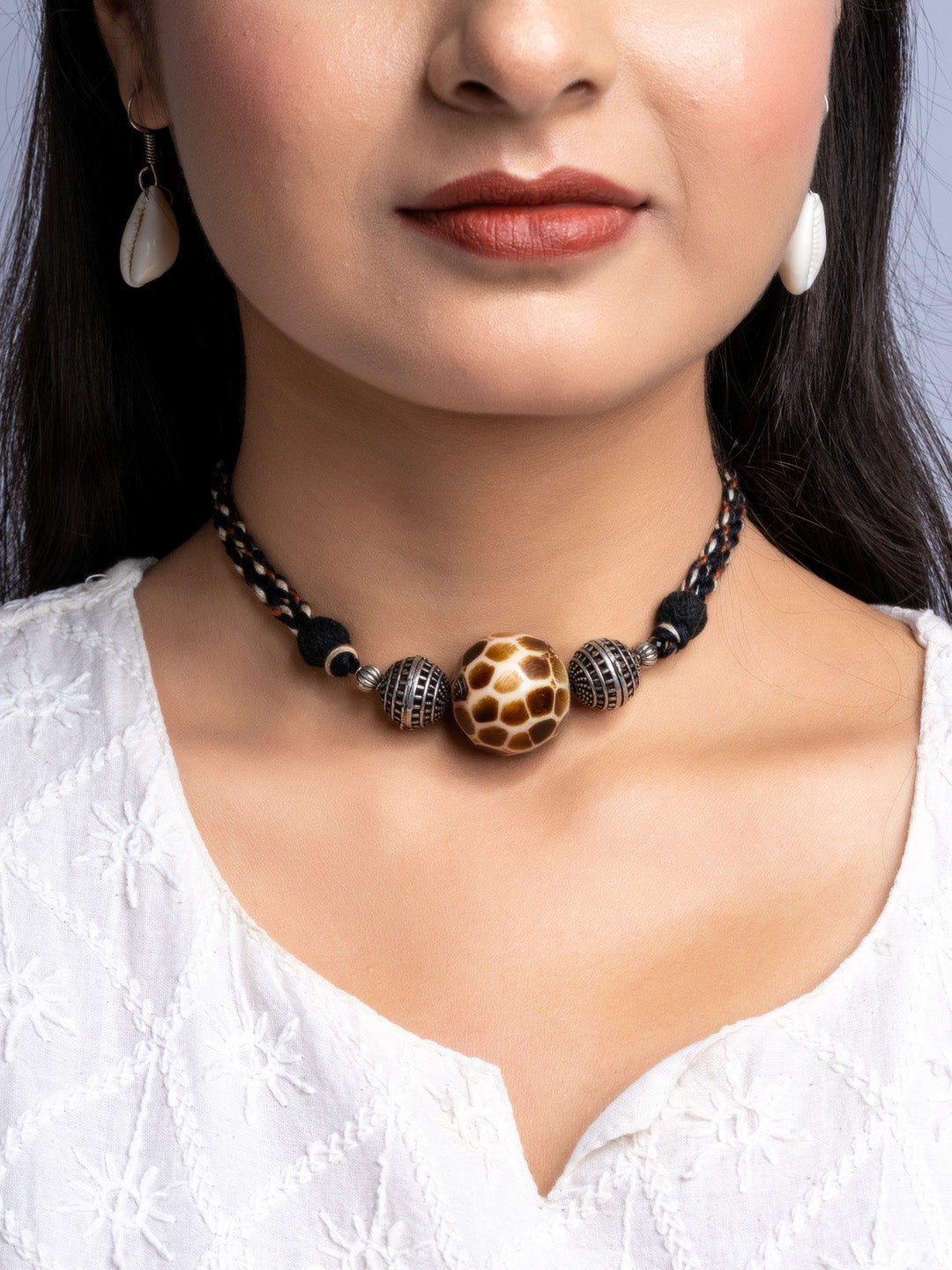 Handmade german silver choker set with intricate beads worn by woman in white top