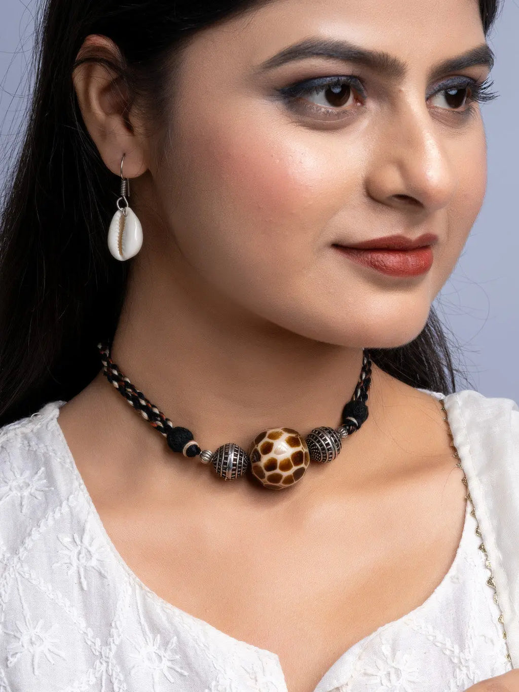 Handmade german silver choker set with intricate beads and central patterned pendant worn by woman