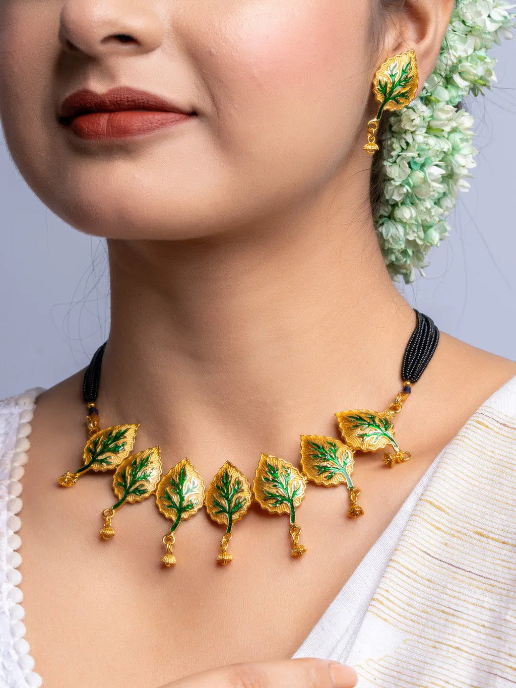 LOOK AND ADORN gold plated leaf design necklace and matching earrings with black bead chain