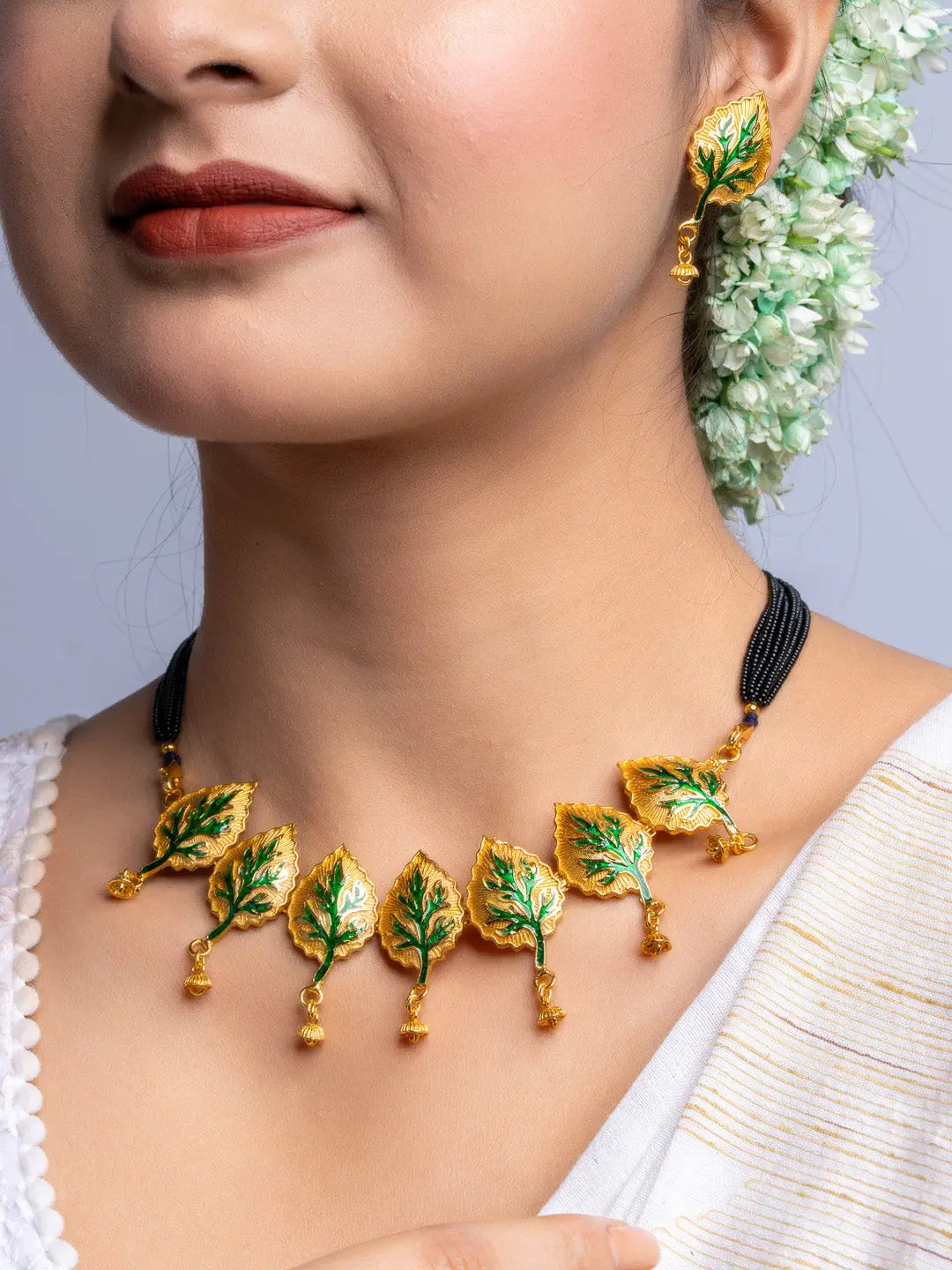 LOOK AND ADORN gold plated leaf design necklace and matching earrings with black bead chain