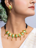 LOOK AND ADORN gold plated leaf design necklace and matching earrings set on model