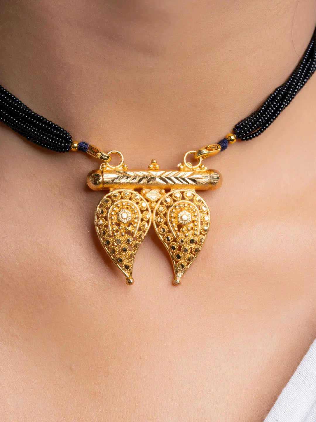 LOOK AND ADORN gold plated necklace with detailed twin leaf pendant on black beaded chain